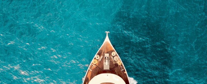 birds eye photography of boat on body of water